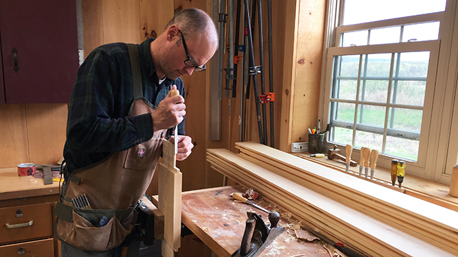 Seth Cassell woodworking in his workshop