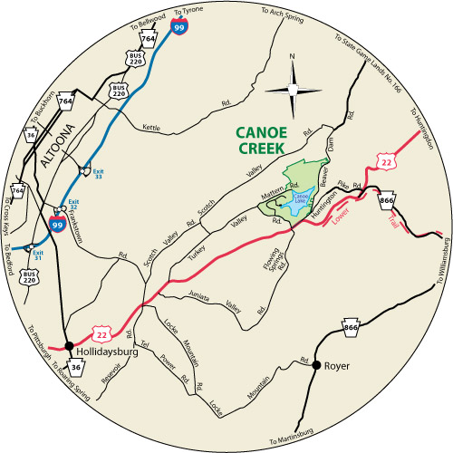 A circular map that shows the roads near Canoe Creek State Park