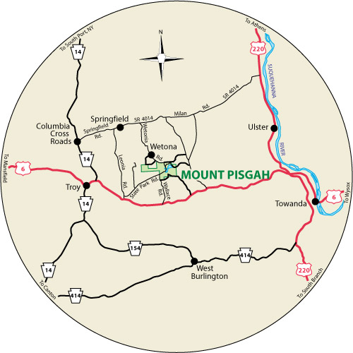 A circular map that shows the roads surrounding Mount Pisgah State Park