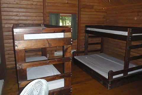 Bunkbeds are in a cozy wooden cottage at Chapman State Park.