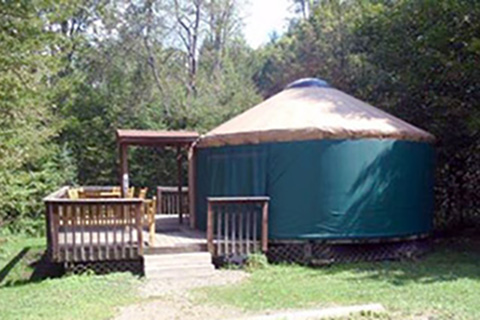 A round tent has a porch at Chapman State Park.