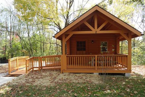 A log cabin has a porch and ramp at Ryerson Station State Park.