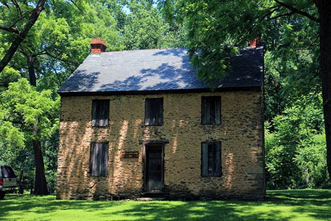 A stone house is surrounded by trees at Susquehannock State Park, Pennsylvania.